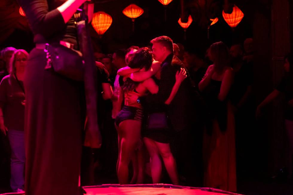 Performers embrace during the closing night of Lost Spirits Distillery at Area15 on Monday, Apr ...