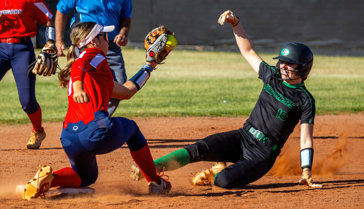 Coronado infielder Bailey Goldberg (1) grabs a throw as Palo Verde runner Mya Bartlett (18) att ...