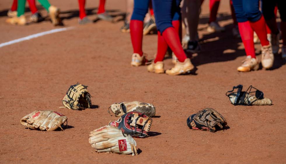 Palo Verde gloves lay in the dirt after defeating Coronado 2-0 following the seventh inning of ...