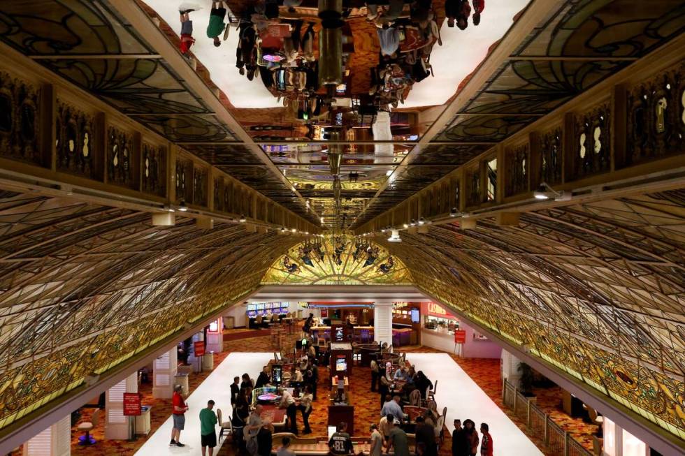 Guests gamble underneath the stained glass ceiling at the Tropicana Las Vegas on Friday, March ...