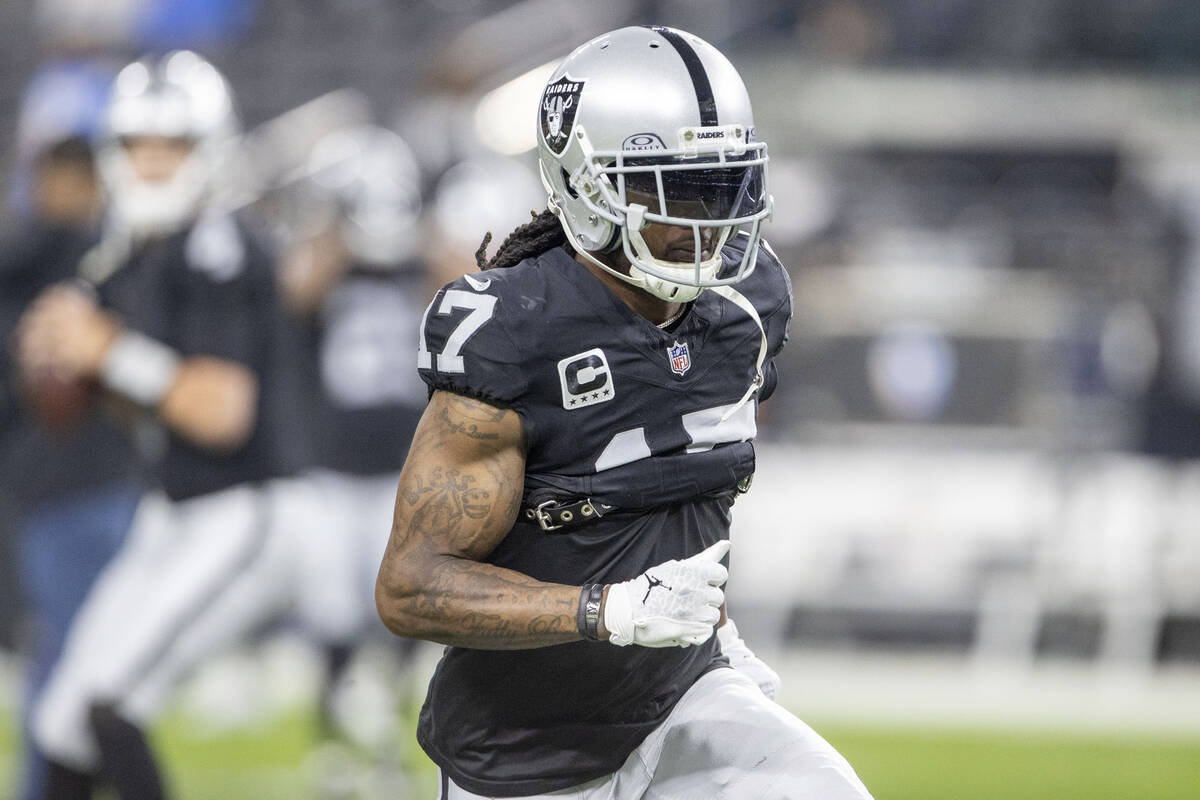 Raiders wide receiver Davante Adams (17) warms up before an NFL game against the Los Angeles Ch ...