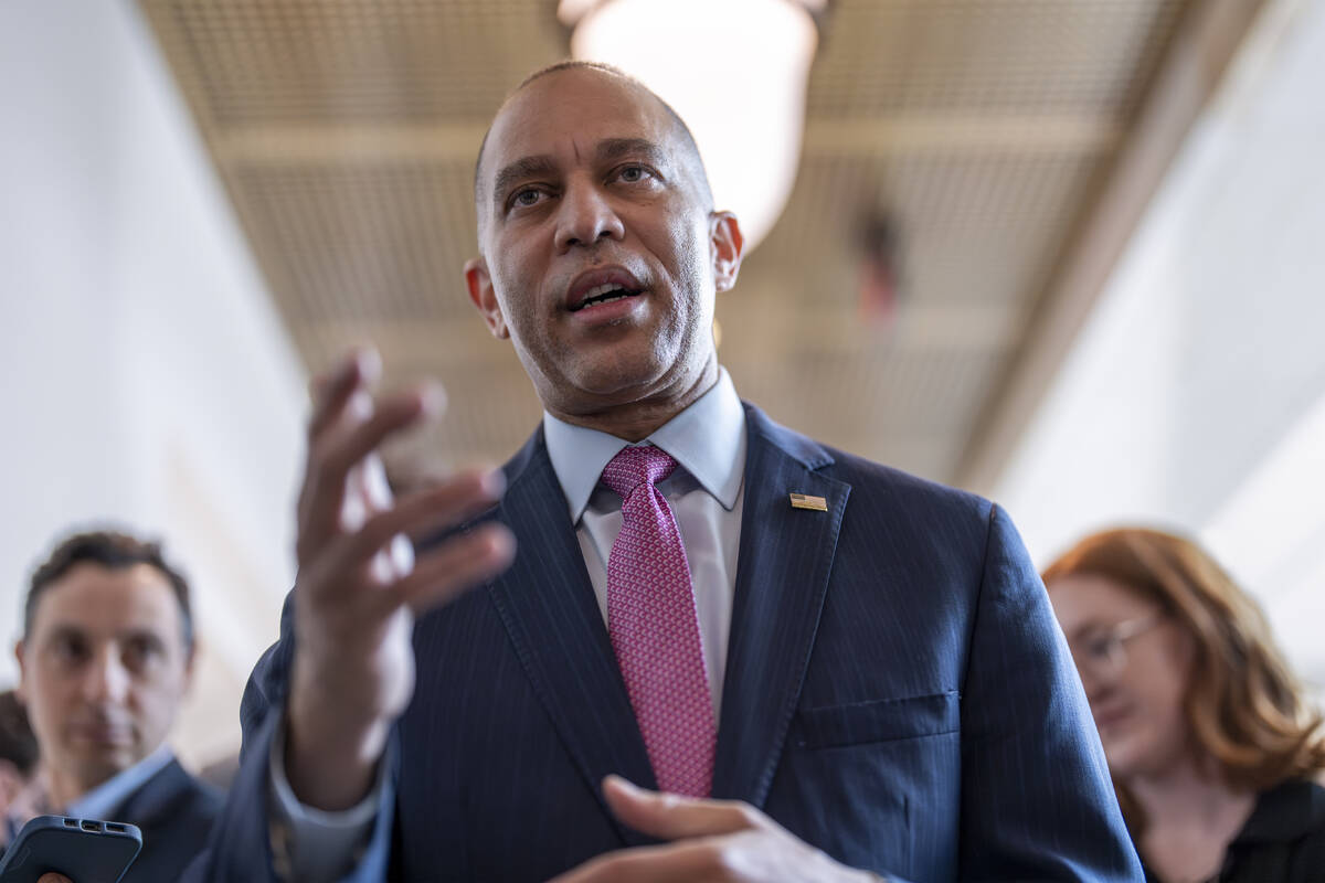 House Minority Leader Hakeem Jeffries, D-N.Y., walks with reporters after lawmakers pushed a $9 ...