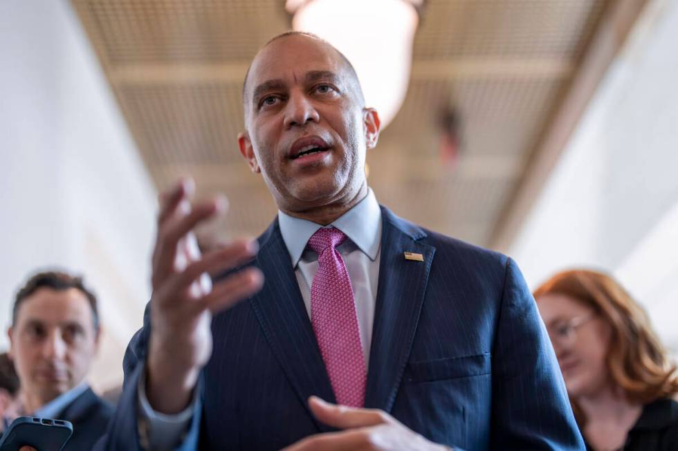 House Minority Leader Hakeem Jeffries, D-N.Y., walks with reporters after lawmakers pushed a $9 ...