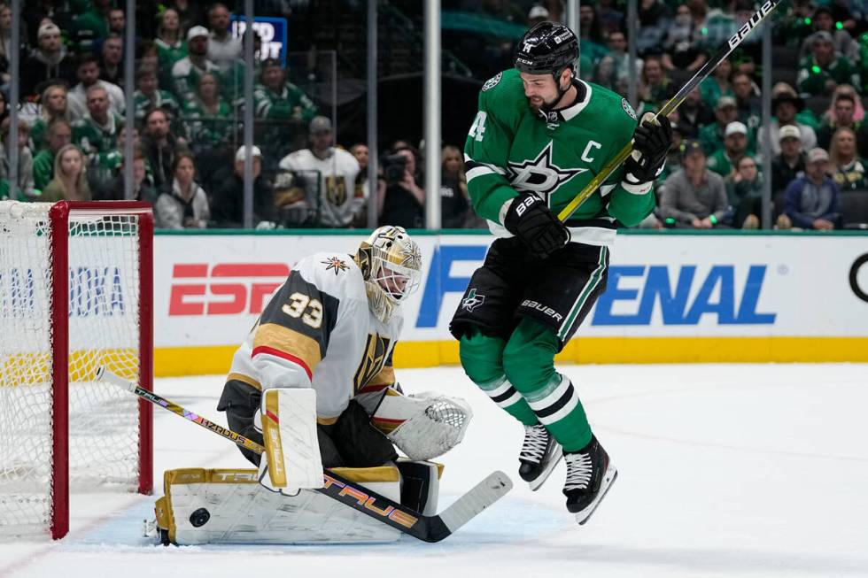 Vegas Golden Knights goaltender Adin Hill (33) blocks a shot under pressure from Dallas Stars l ...