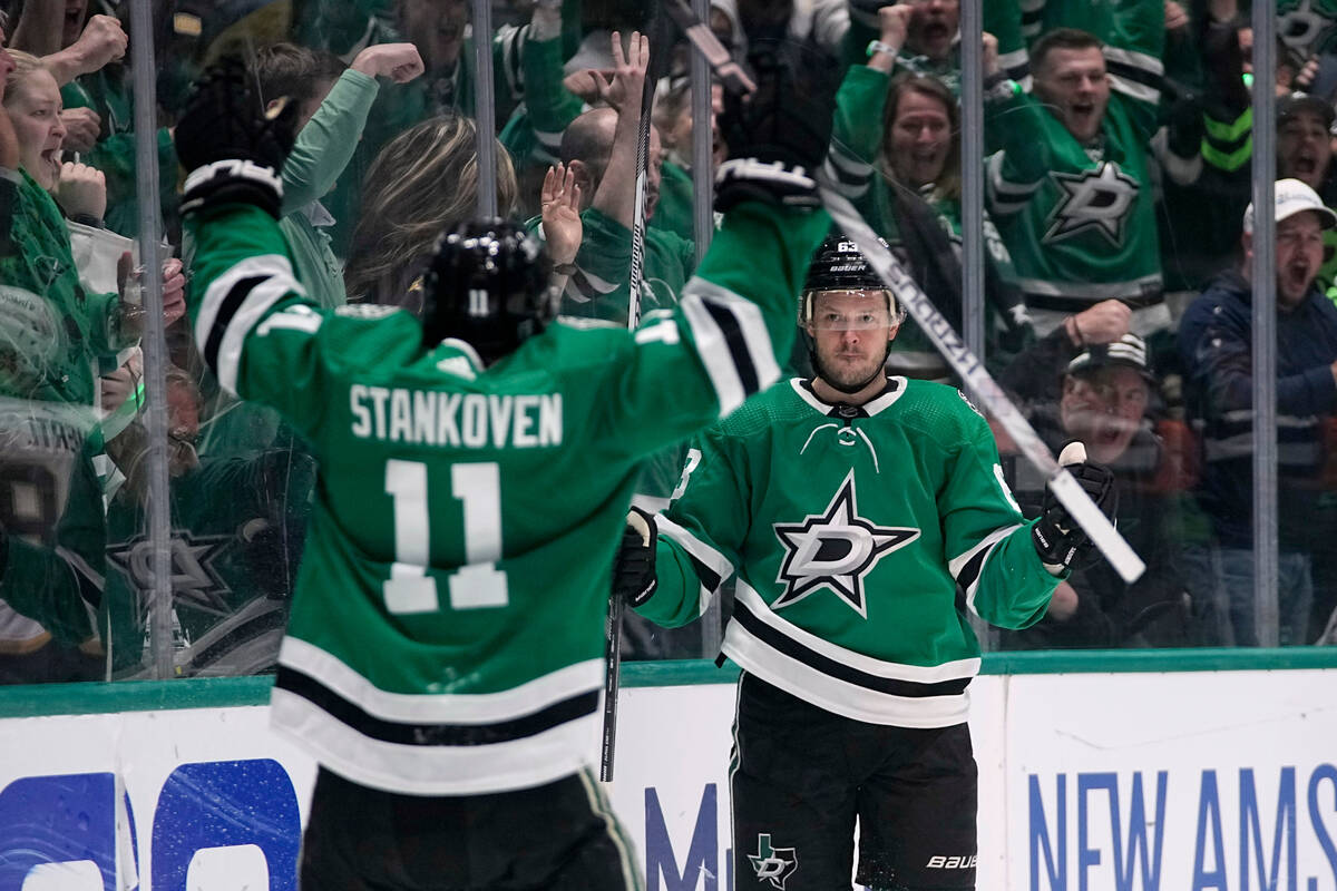 Dallas Stars' Logan Stankoven (11) and Evgenii Dadonov (63) celebrate a goal scored bby Dadonov ...