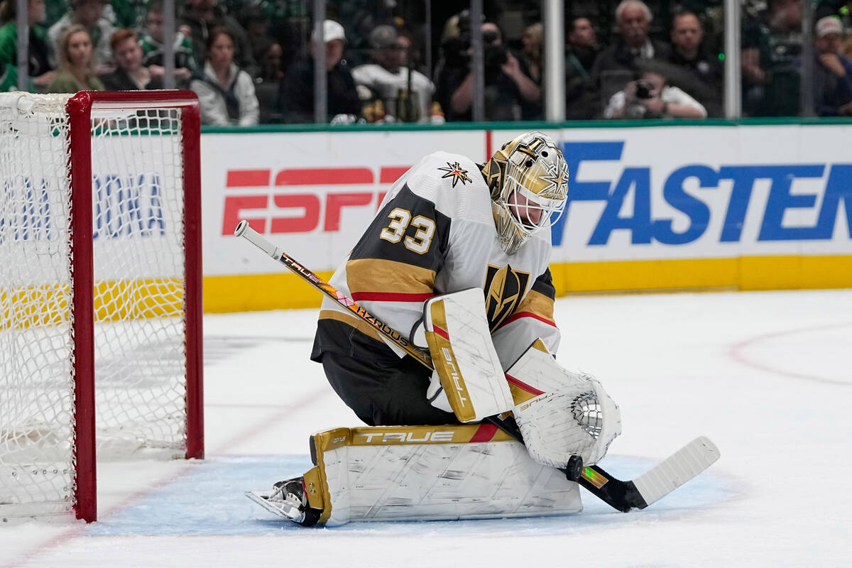 Vegas Golden Knights goaltender Adin Hill blocks a shot from the Dallas Stars in the first peri ...