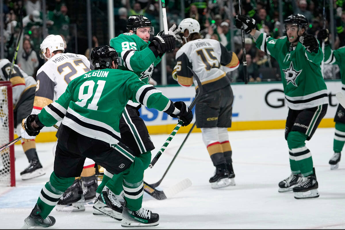 Dallas Stars' Tyler Seguin (91), Matt Duchene (95) and Wyatt Johnston, right, celebrate a goal ...