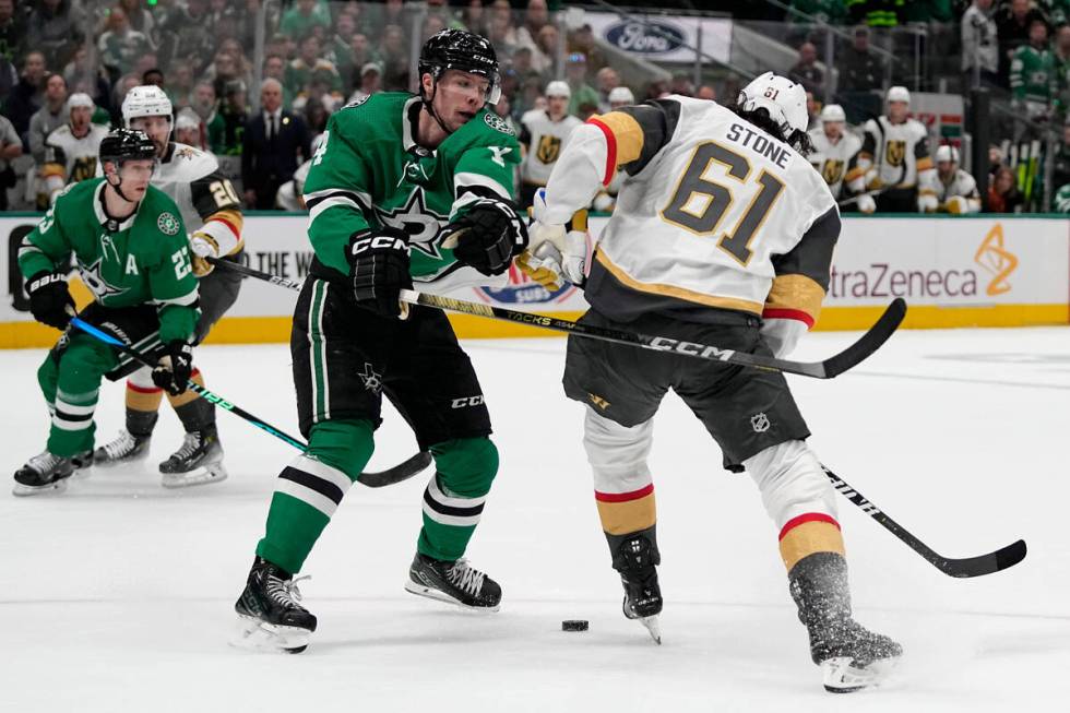 Dallas Stars defenseman Miro Heiskanen (4) and Vegas Golden Knights right wing Mark Stone (61) ...