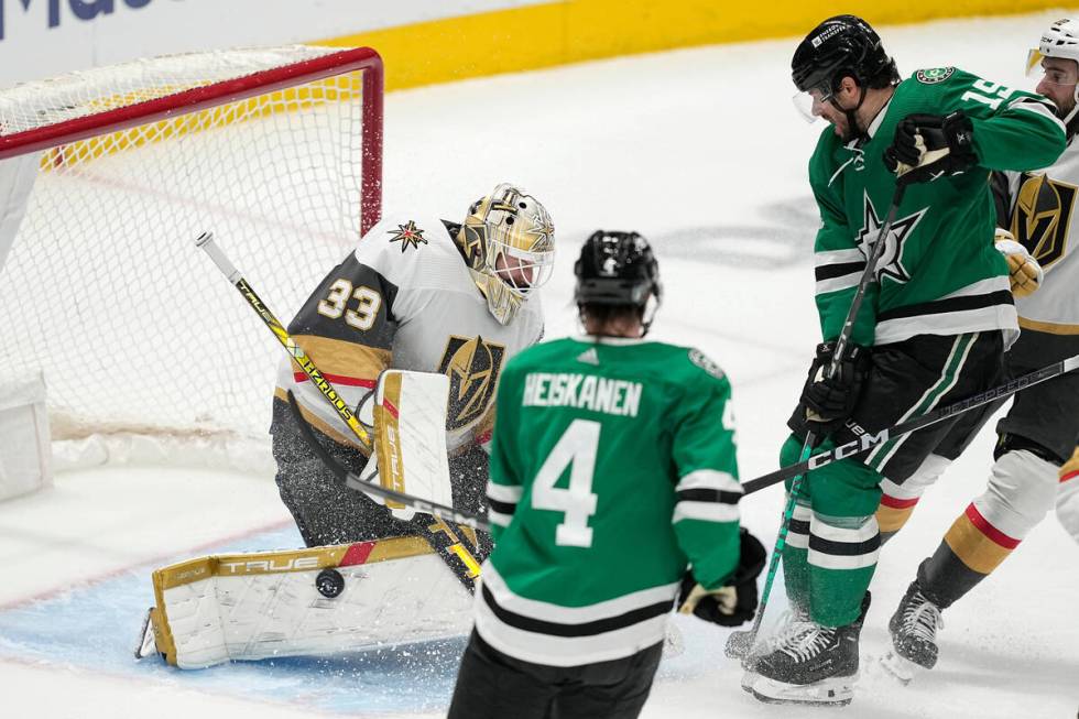 Vegas Golden Knights goaltender Adin Hill (33) blocks a shot from Dallas Stars' Craig Smith (15 ...