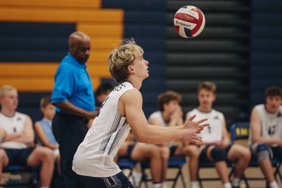 Centennial setter Thomas Taylor (2) serves the ball during a boys volleyball game between Cente ...