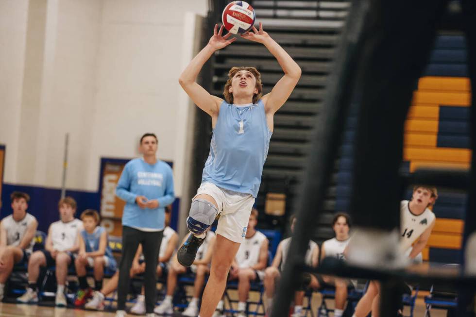 Centennial libero Nicholas Tsai (1) attacks the ball during a boys volleyball game between Cent ...