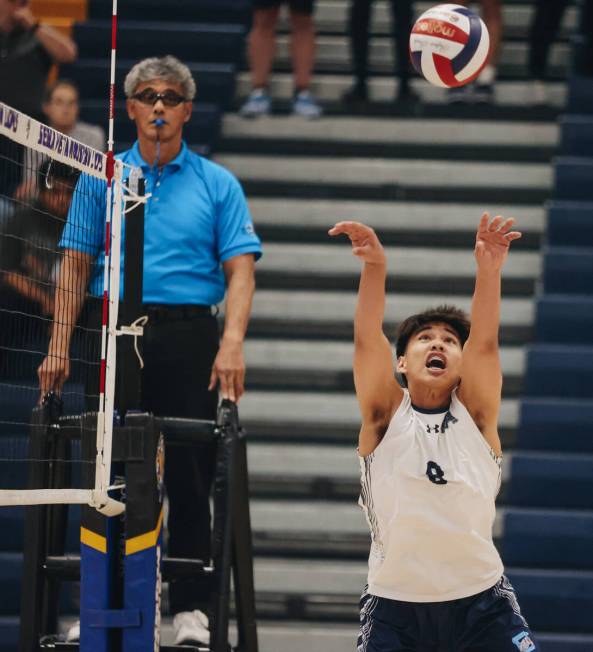 Centennial setter Rastelli Regaldo (8) attacks the ball during a boys volleyball game between C ...