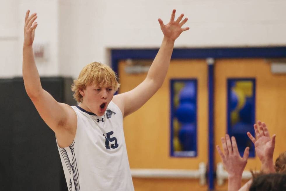 Centennial outside hitter Austin Randolph (15) celebrates his team catching up to win an eventu ...