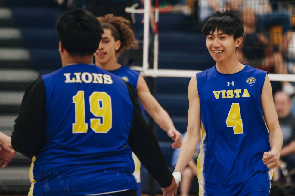 Sierra Vista teammates celebrate during a boys volleyball game between Centennial and Sierra Vi ...