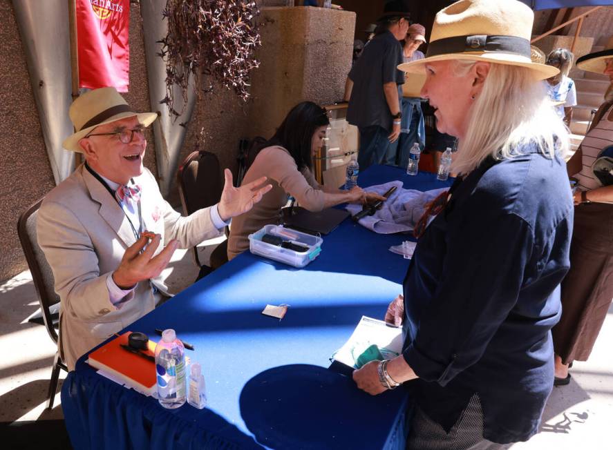 Asian arts expert Lark Mason talks to Marilyn of Sherman Oaks, Calif. about her jade dress orna ...