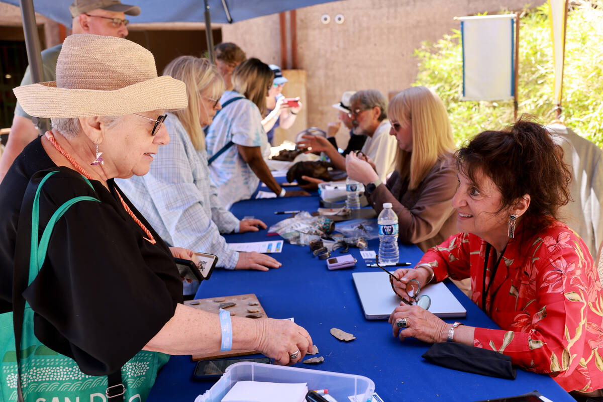 Linda, left, talks to expert Anna Bono about arrowheads and other tools from central Ohio durin ...