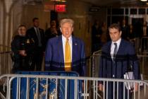 Former President Donald Trump talks to the media outside Manhattan Criminal Court, Thursday, Ma ...