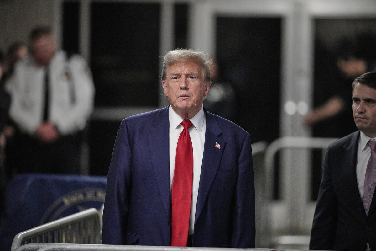 Former President Donald Trump speaks to the media outside the courtroom of his trial at Manhatt ...