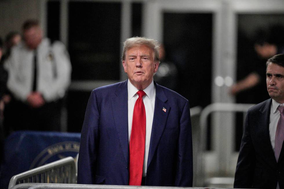 Former President Donald Trump speaks to the media outside the courtroom of his trial at Manhatt ...