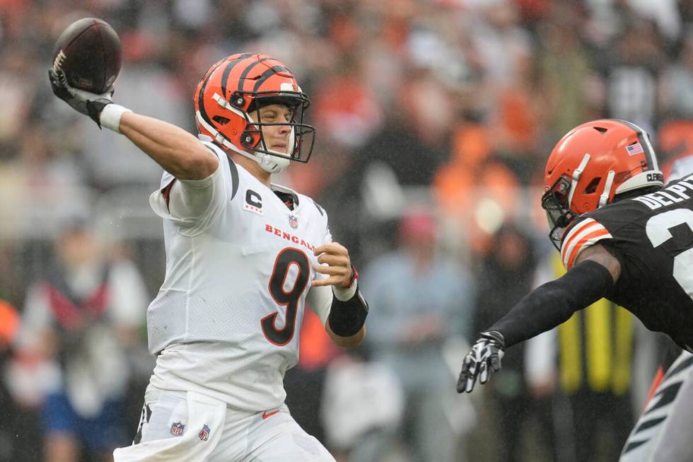 Cincinnati Bengals quarterback Joe Burrow (9) passes during an NFL football game against the Cl ...