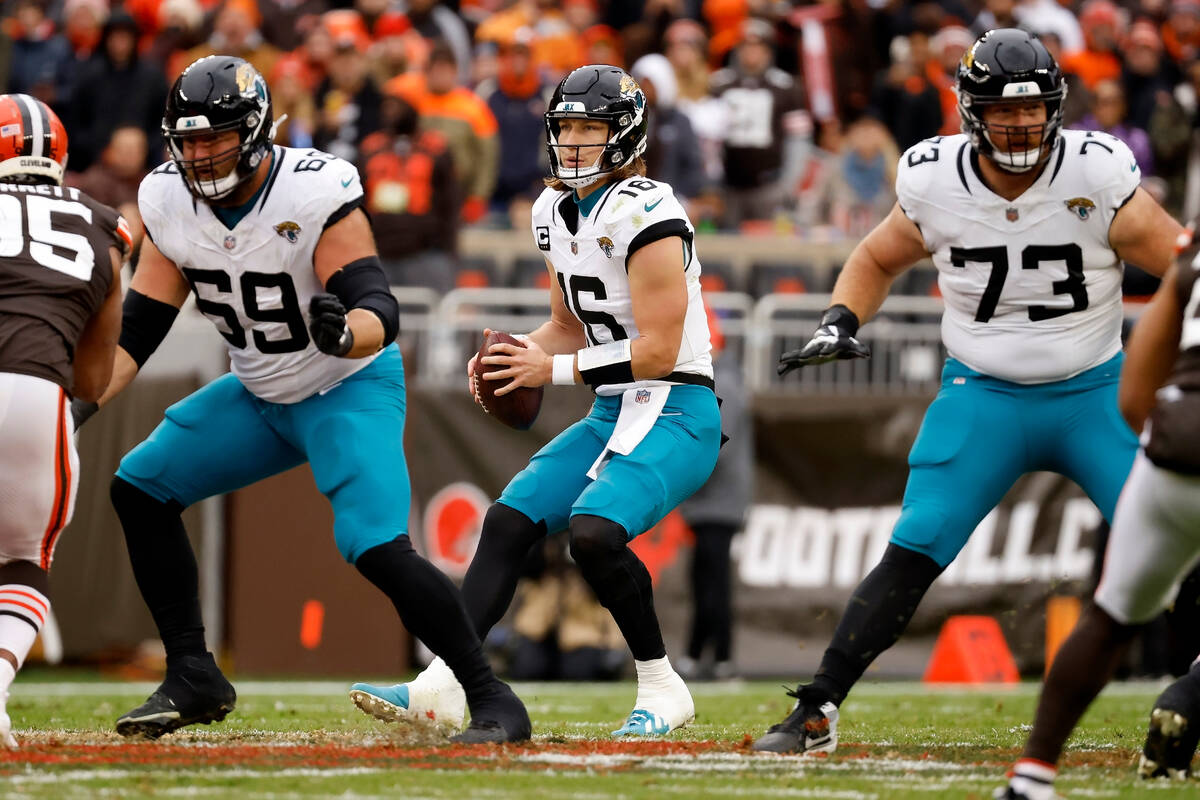 Jacksonville Jaguars quarterback Trevor Lawrence (16) looks to throw the ball during an NFL foo ...