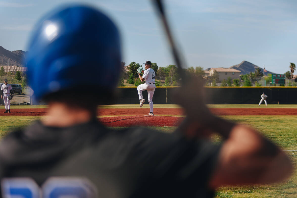 Palo Verde pitcher Dylan Feeny (13) pitches as a Sierra Vista player warms up during a baseball ...