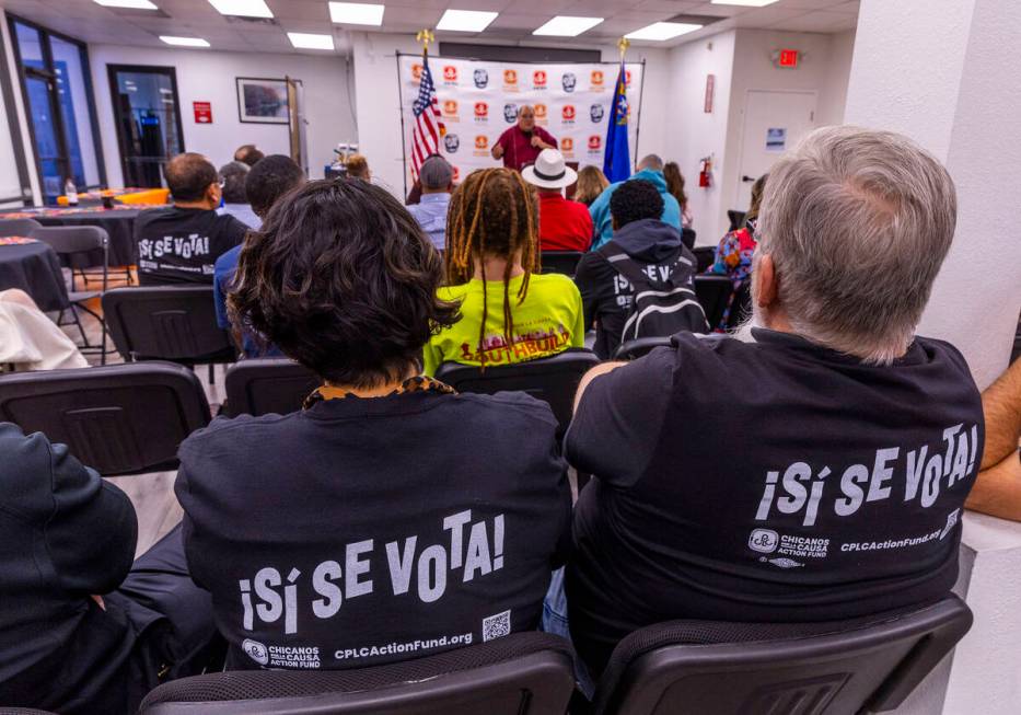 Participants listen as Joseph Garcia speaks during the 2024 Latino Loud nonpartisan voter regis ...