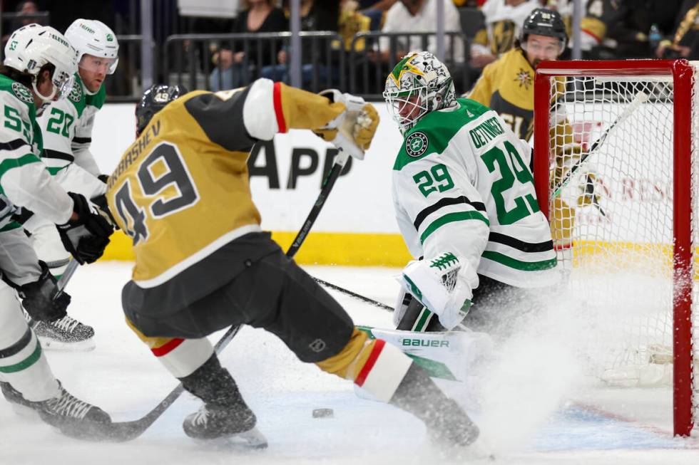 Golden Knights center Ivan Barbashev (49) shoots against Stars goaltender Jake Oettinger (29) d ...