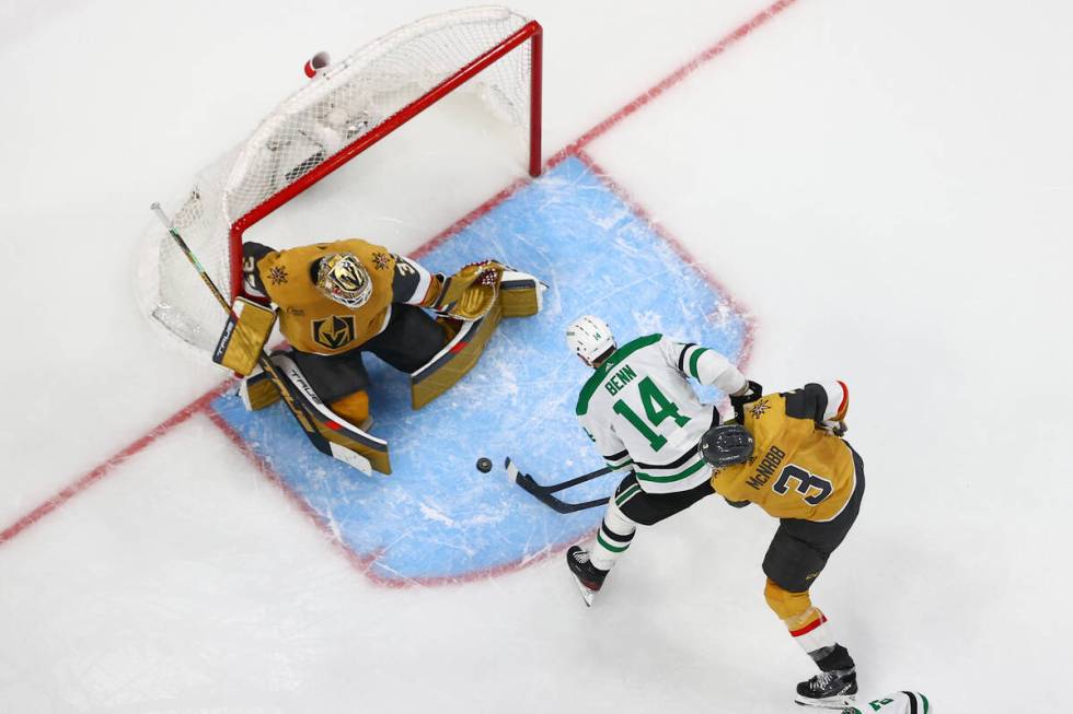 Stars left wing Jamie Benn (14) attempts a goal on Golden Knights goaltender Adin Hill (33) whi ...