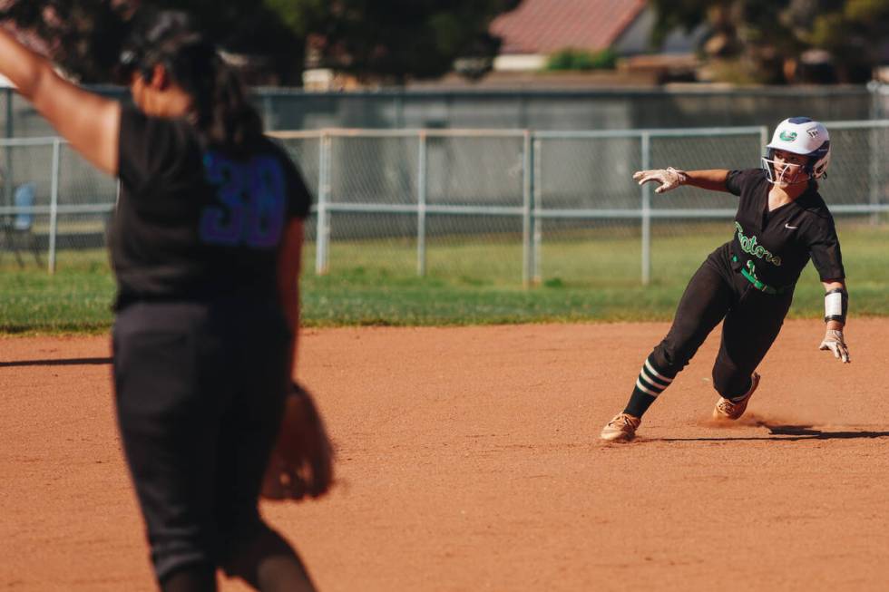 Green Valley’s Emery Gonzalez (1) races to second base during a softball game between Si ...