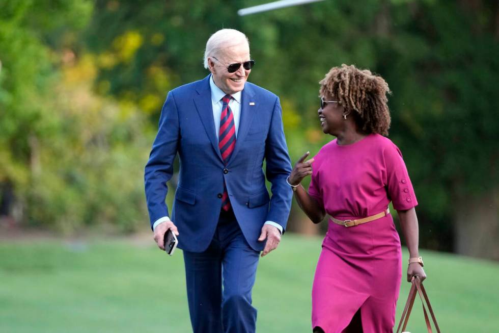 President Joe Biden walks across the South Lawn of the White House as he talks with White House ...