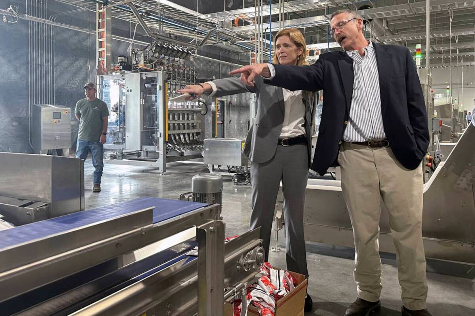 USAID Administrator Samantha Power talks with Mana operations director Harry Broughton during a ...