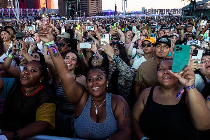 Fans react as Ja Rule performs during the Lovers & Friends music festival on Saturday, May ...