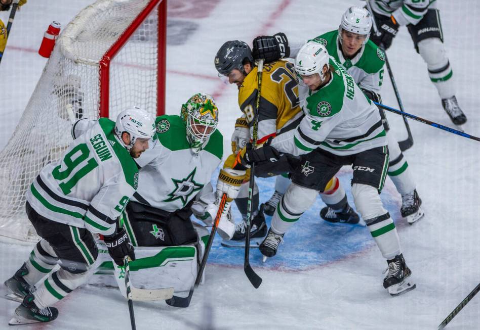 Golden Knights left wing William Carrier (28) battles near the net against Dallas Stars defense ...