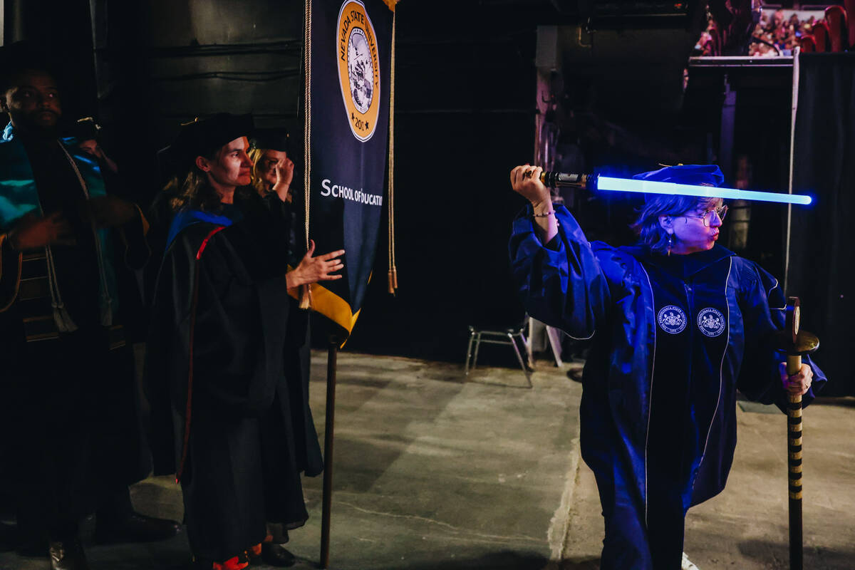 Doctor Molly Appel, faculty senate chair at Nevada State, less graduates out with a lightsaber ...