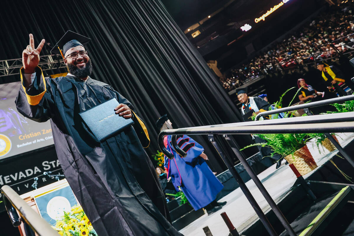 Graduates participate in the Nevada State University commencement ceremony at the Thomas & ...