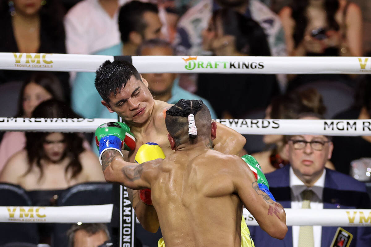 Fabián Maidana takes a hit from Mario Barrios in a WBC interim world welterweight title bo ...