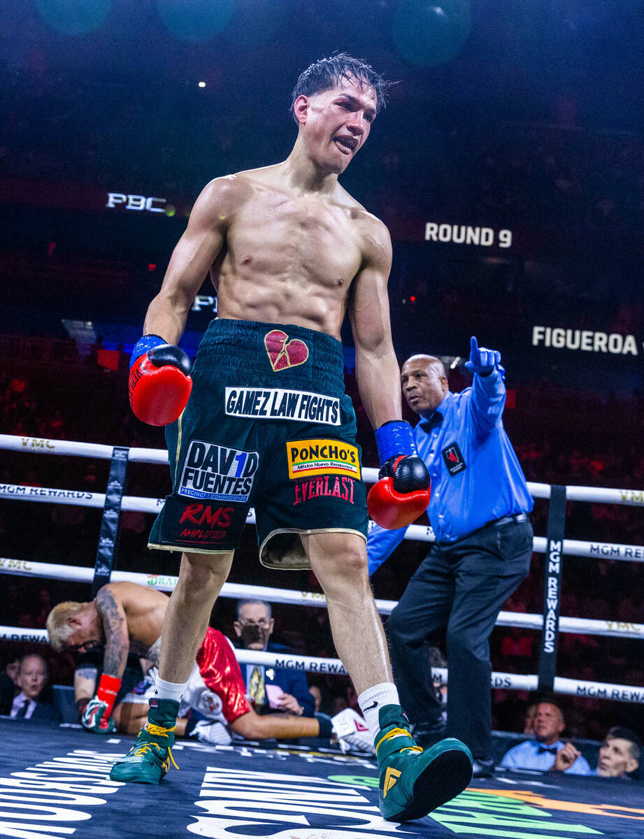 Featherweight Brandon Figueroa walks away after knocking down Jessie Magdaleno during the ninth ...