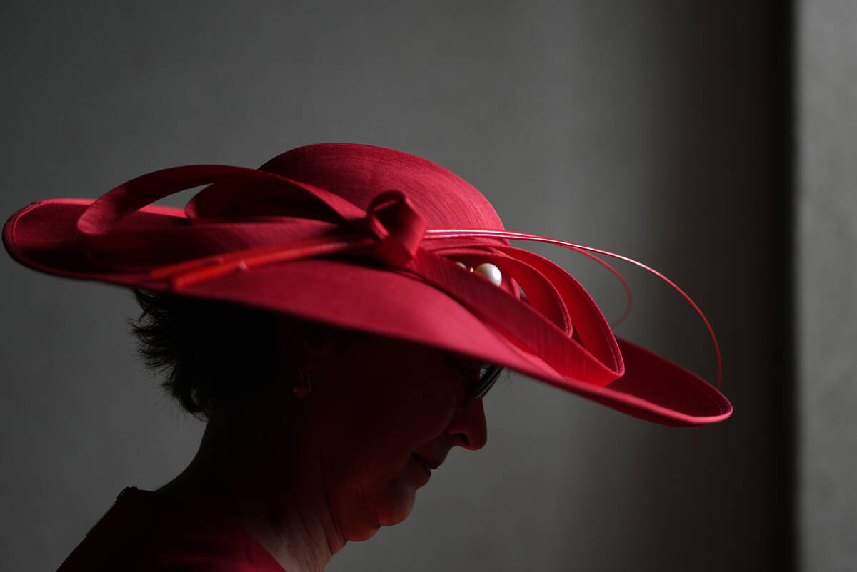 A race fan walks though the stands at Churchill Downs before the 150th running of the Kentucky ...