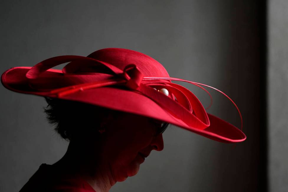 A race fan walks though the stands at Churchill Downs before the 150th running of the Kentucky ...