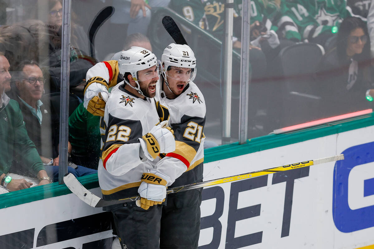 Vegas Golden Knights center Brett Howden (21) celebrates his second period goal with Michael Am ...
