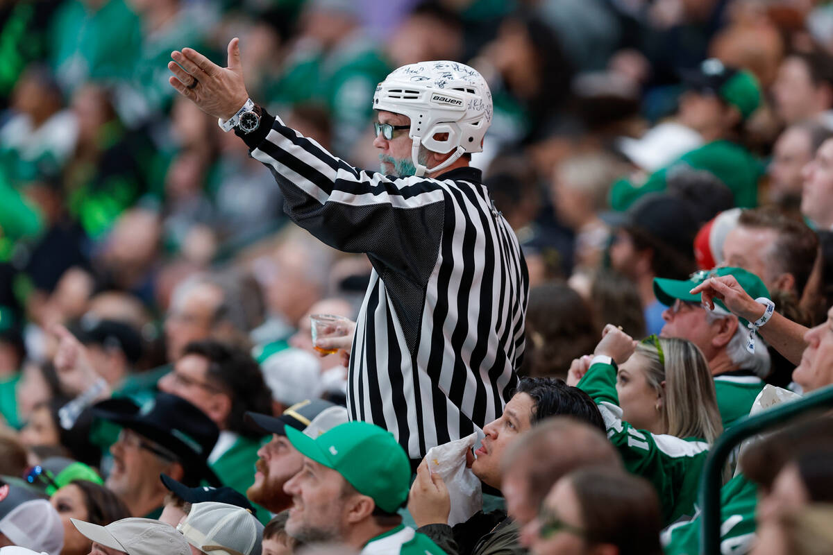 A spectator reacts during the second period in Game 7 of an NHL hockey Stanley Cup first-round ...