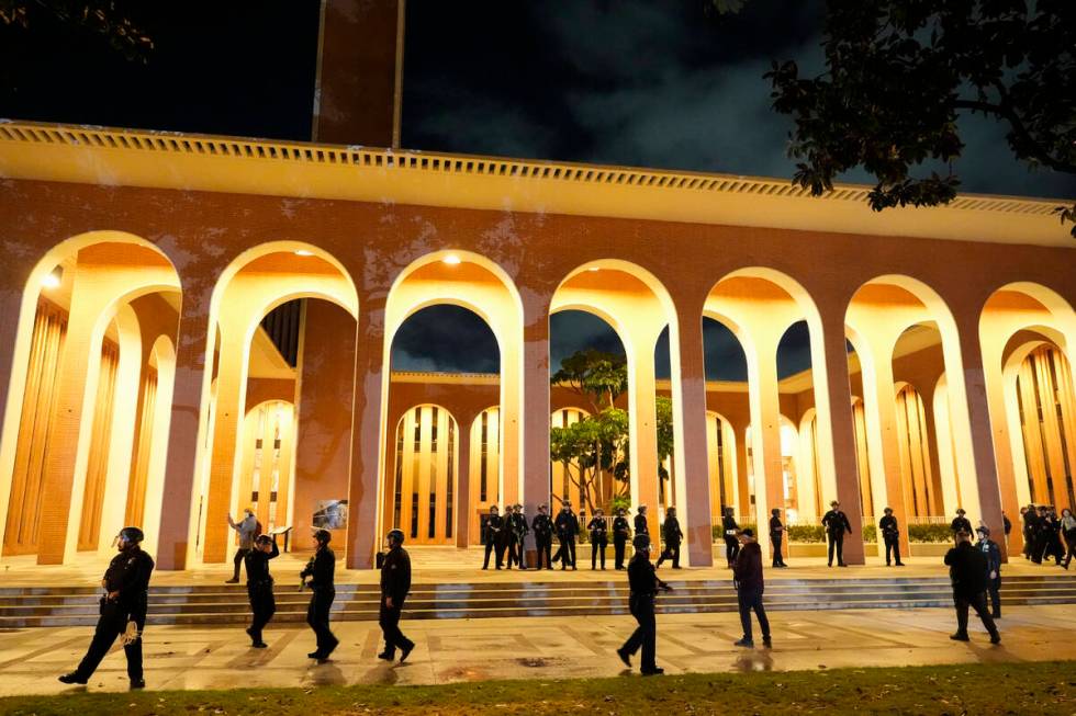 Police gather on the campus at the University of Southern California prior to clearing out an e ...