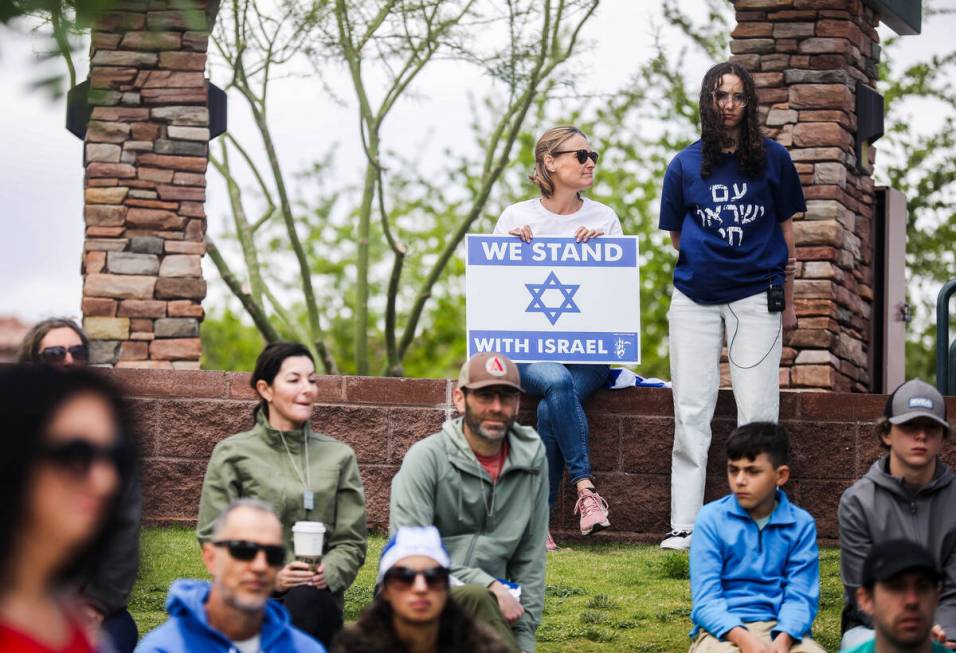 Participants listen during a rally hosted by the Las Vegas chapter of the Israeli-American Coun ...