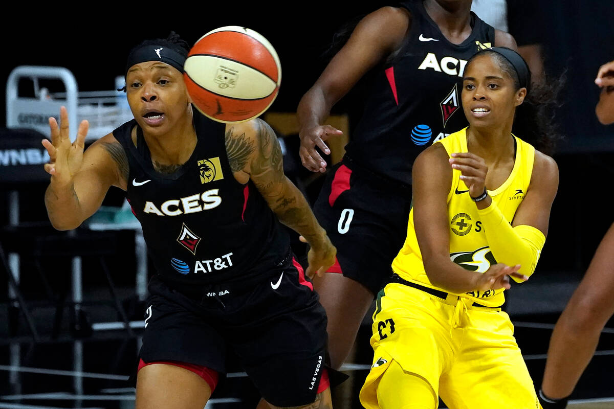 Seattle Storm guard Jordin Canada (21) works against Las Vegas Aces forward Emma Cannon during ...