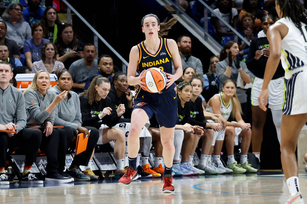 Indiana Fever guard Caitlin Clark (22) moves upcourt against the Dallas Wings during the first ...