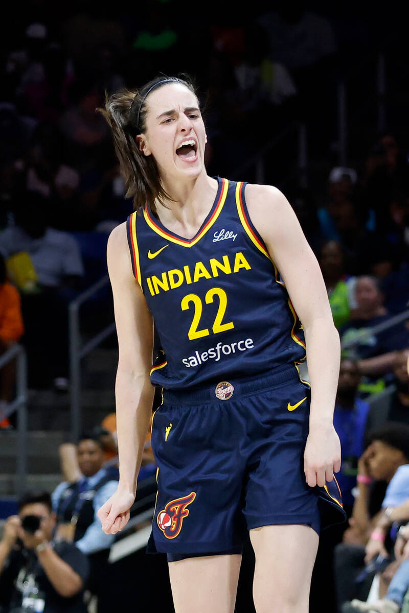 Indiana Fever guard Caitlin Clark (22) reacts after making a three-point basket against the Dal ...