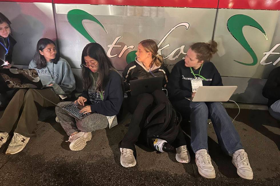 Staff members of the Columbia Daily Spectator, the college newspaper, work into the night as po ...