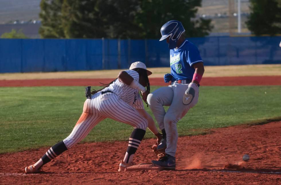 Shadow Ridge's Christian Wilkes (30) misses the pass to try and tag out Green Valley's Caden Ki ...