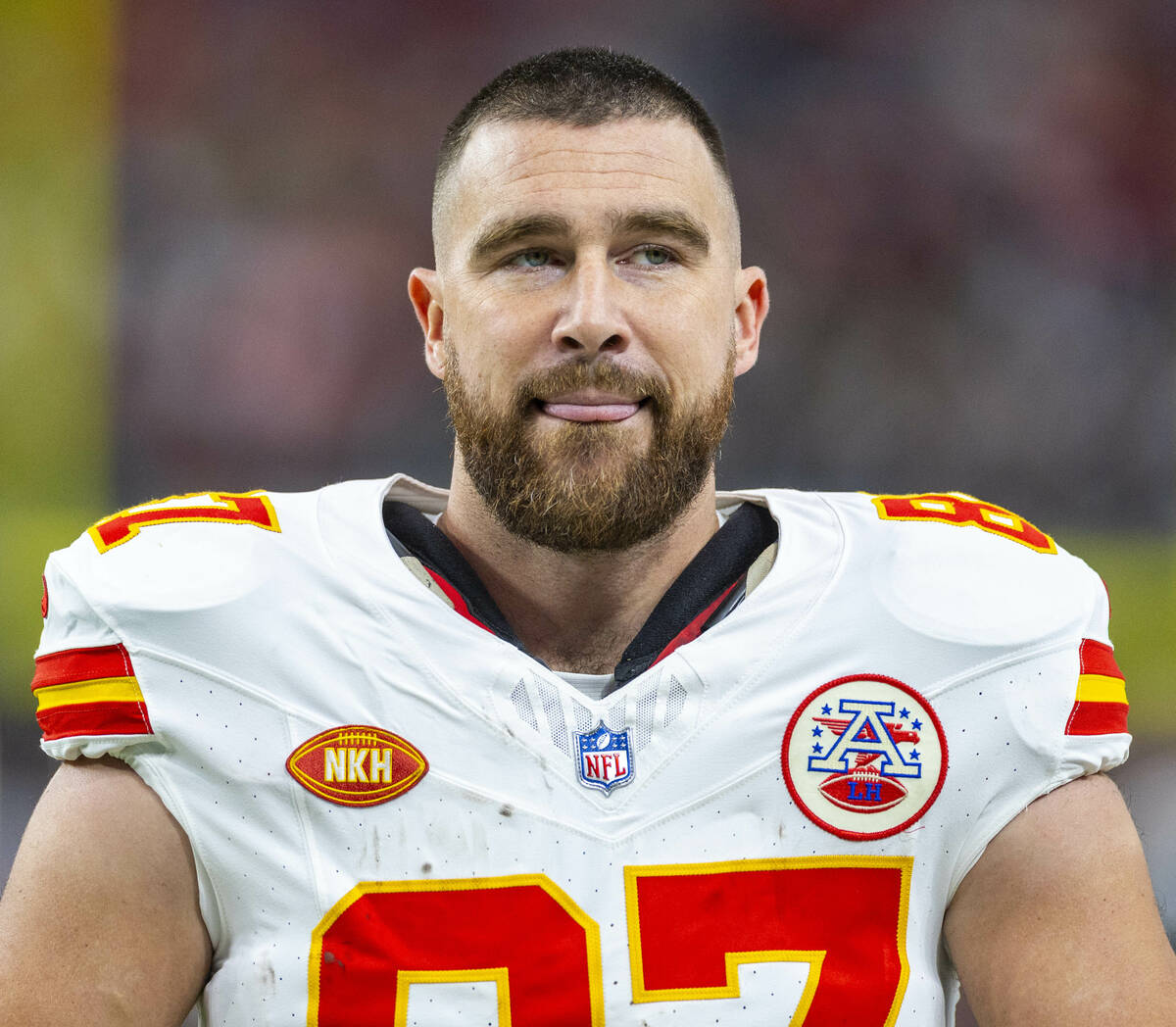 Kansas City Chiefs tight end Travis Kelce (87) stands with his tongue out on the sideline again ...